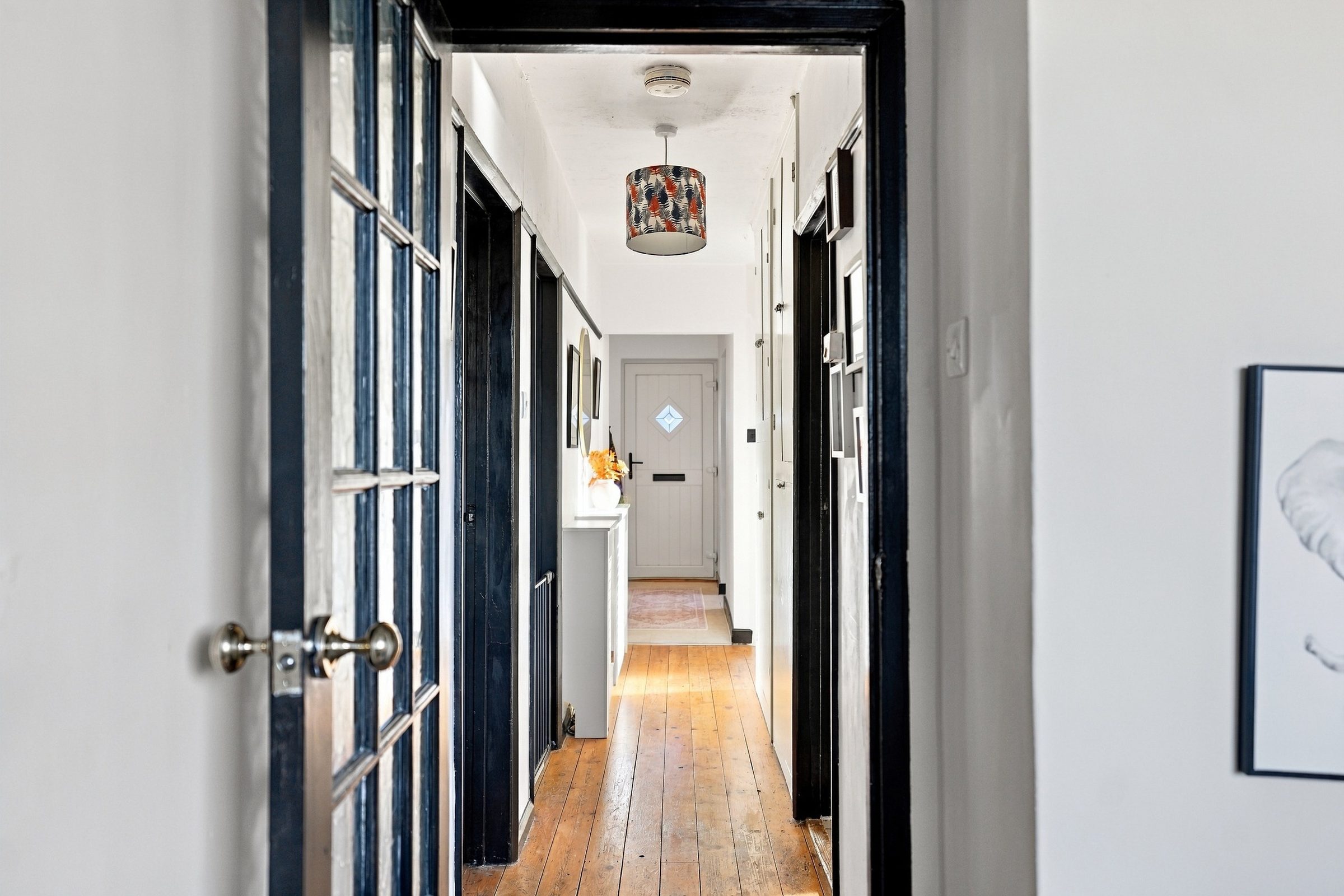 The hall, looking through the glazed door to the front door