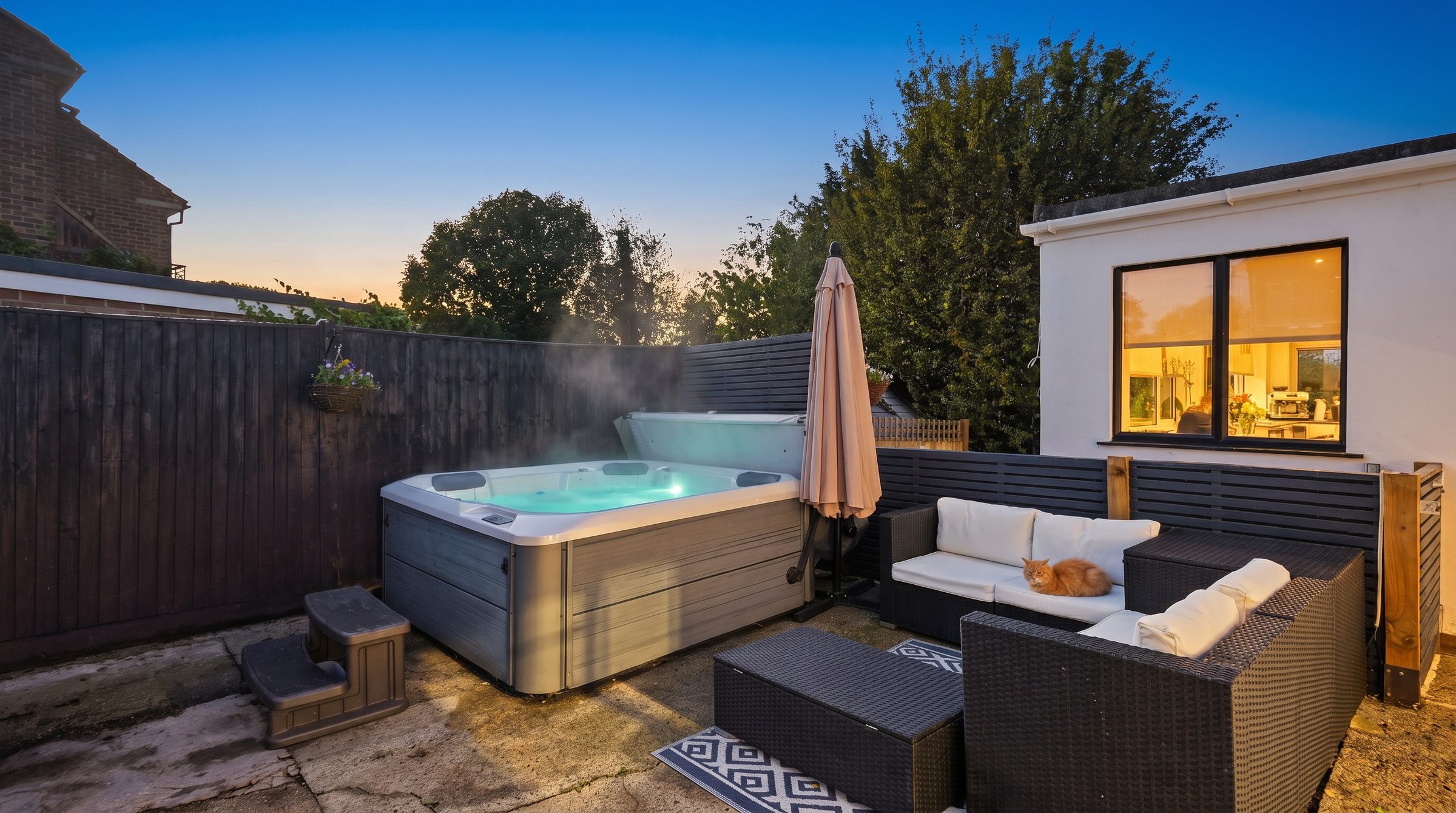 The hot tub lit at dusk